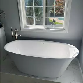 Luxury bathroom renovation with a freestanding tub and spa-like finishes. Selective Remodeling specializes in high-end bathroom upgrades across Long Island.