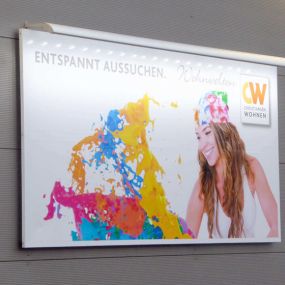 Außenwerbung - beleuchtetes Werbeplakat mit Wandmontage von Erdmann Werbetechnik aus Buxtehude in Niedersachsen.