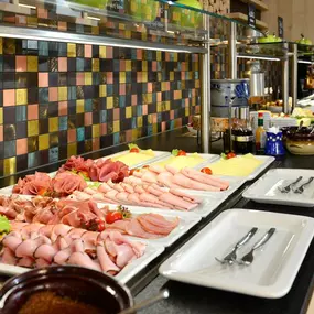 breakfast buffet with regional sausagees and cheeses