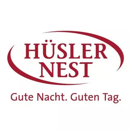 Logotyp från Hüsler Nest Thun