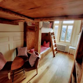 Our triple room Swiss style is a warm wooden wonder