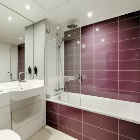 Premier Inn Hamburg City Klostertor hotel bathroom with bathtub and shower