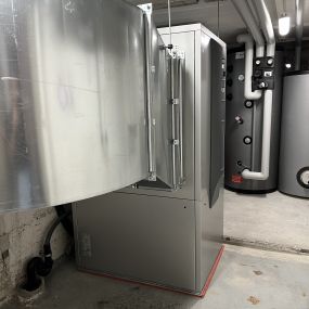 Heizungssanierung EFH Ersatz Ölheizung durch Innenaufgestellte Luft/Wasser Wärmepumpe