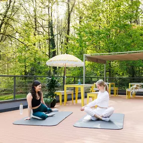 POHA House Preuswald Community doing yoga. on our outside terrace