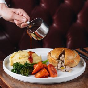 Hand-raised Charter pie, chicken, ham & leek, buttered mash, spring greens