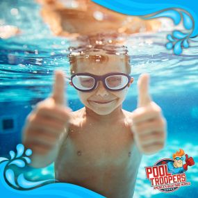 Young Boy Swimming In Clean Pool Water