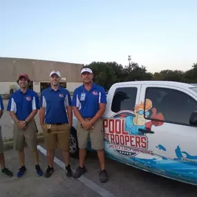 Pool Troopers Technicians Next to a Pool Troopers Service Vehicle