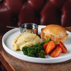 Hand-raised Charter pie, chicken, ham & leek, buttered mash, spring greens