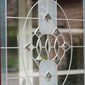 Add that personal touch to your windows, doors or conservatory with our wide range of decorative glass styles. Pictured: bevelled and etched front door design.