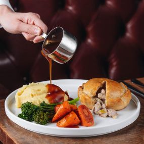 Hand-raised Charter pie, chicken, ham & leek, buttered mash, spring greens