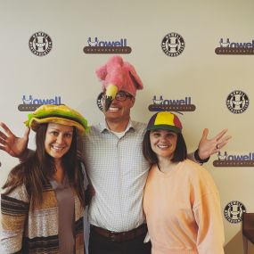 Staff Members At Howell Orthodontics Wearing Funny Hats