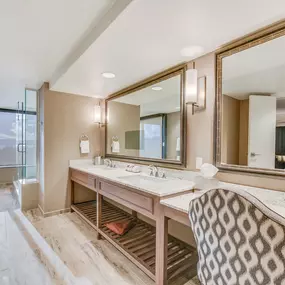 Harvys Lake Tahoe mountain view balcony suite vanity. Elevate your adventure at Harveys Lake Tahoe, the very first casino hotel built on the South Shore.