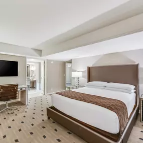 Caesars Republic Lake Tahoe mountain view balcony suite bedroom. Elevate your adventure at Caesars Republic Lake Tahoe, the very first casino hotel built on the South Shore.