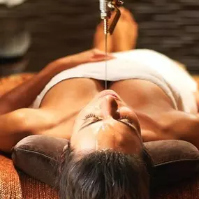 Woman relaxing at Qua Baths and Spa at Caesars Atlantic City. This spa is a luxurious retreat that taps into the natural, healing powers of water to bring you a one-of-a-kind experience. Enjoy this adult-oriented spa atmosphere. Guests 18+ may utilize spa amenities, including our signature Roman baths. Facials, Massage and Body appointments for guests 16+, and must be accompanied by a parent or adult guardian. Contact spa for details.