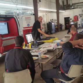Our techs are always learning new ways to serve you better. Plus, they got pizza!