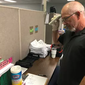 Omni Logistics Houston employee checking temperature in office