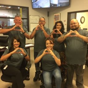 Omni Logistics El Paso staff members holding up Omni O
