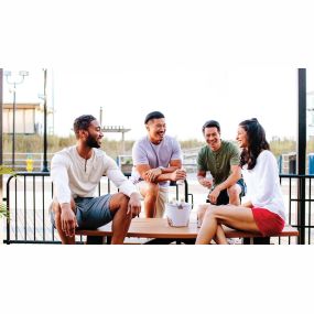 Friends on patio at Boardwalk Saloon at Caesars Atlantic City.