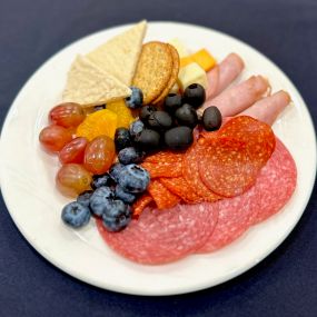 Charcuterie plate: Salami, pepperoni, fresh fruit, cheese, crackers