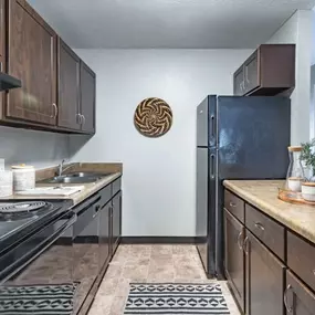 Kitchen at Nemoke Trails apartments in Haslett, MI