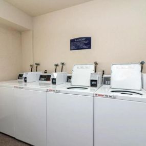Laundry room at Lakewood Apartments in Haslett, MI