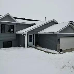 Our crew recently installed new Norandex Woodsman D5DL vinyl siding in the color Seaport on this home in St. Michael, MN.