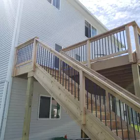 Create a welcoming entrance to your home with a classic wooden deck from Wild Construction.