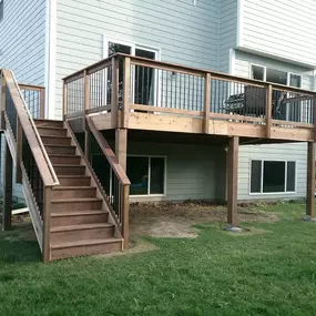 Create a versatile outdoor space with a deck and stairs from Wild Construction.