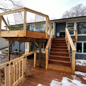 Extend your living space and enjoy the outdoors with a beautiful wooden deck from Wild Construction Inc.