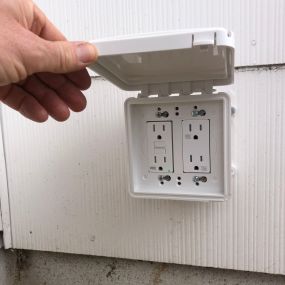 Installed an exterior rated WR (weather-resistant)  quad receptacle. Dedicated 20 amp line with GFCI (ground-fault circuit interruption) protection.