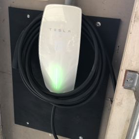 Tesla Charging station with a 60 amp 240 volt dedicated electrical circuits.