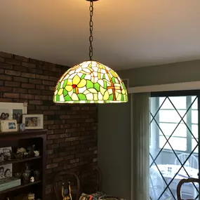 Removed the existing fixture and installed this beautiful Tiffany glass fixture made by Electrical Lamps Plus.