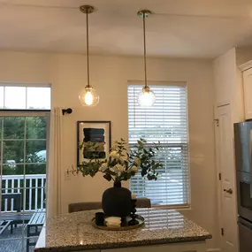 New lighting fixtures for the kitchen island. Lighting from West Elm land Feit Electric 12 watt 2700K LED dimmable bulbs.