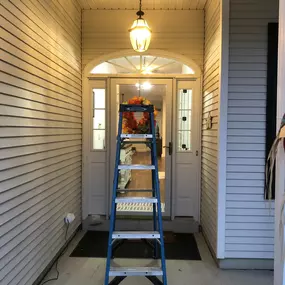 Installed a Hampton Bay electrical fixtures and to brighten up the area. Added Feit Electric 60 watt LED bulbs with a clear glass. The result was a transformed foyer/porch area, bathing in a warm, lovely glow!