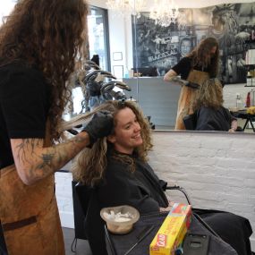 Erik working on a customers hair