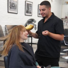 Joey working on a customers hair