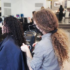 Erik working on a customers hair