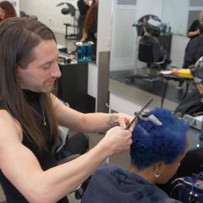 Michael working on a customers hair