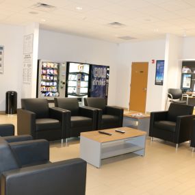 Comfy customer lounge with TV, WiFi and other amenities.