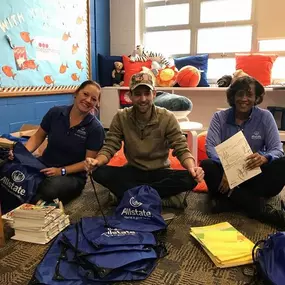 We gave out school supplies to the children at Peabody Elementary School.