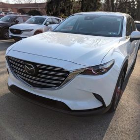 2021 Mazda CX9 Touring in Snowflake White.