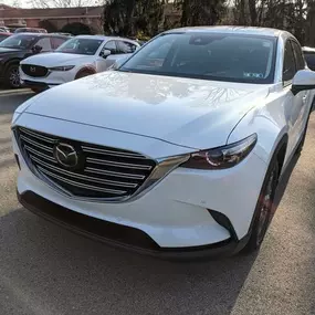 2021 Mazda CX9 Touring in Snowflake White.