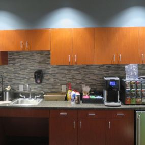 We have a full snack bar in our waiting area.  Stop by for a cup of coffee today.