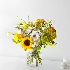 Sunshine in a vase! Hello Sunshine Bouquet is bright mix of sunflowers, daisies & lush greens is perfect for any occasion. Order flowers online from the best florists in Port Saint Lucie. Same-day flower delivery available.