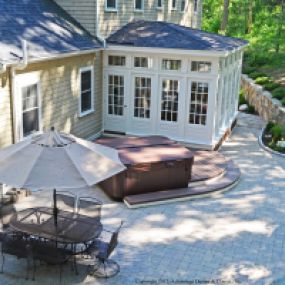 Sunroom, patio and hot tub make the ultimate in Durham outdoor living.