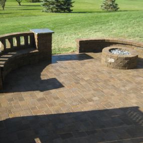 New paver patio with bench wall and fire pit in Ft Wayne, IN