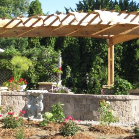 New custom designed cedar pergola on paver patio and wall, in Fort Wayne.