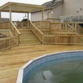 New pool deck, entertainment deck, and pergola in Columbia City, IN