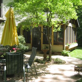 Screened porch trimmed with cedar, with flower box, in Ft Wayne