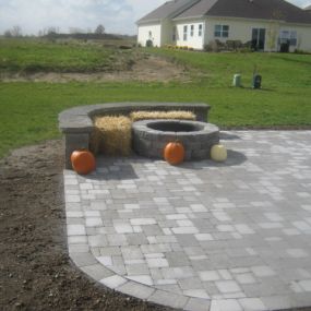 New Belgard paver patio, with bench and  wood burning fire pit in Roanoke, IN